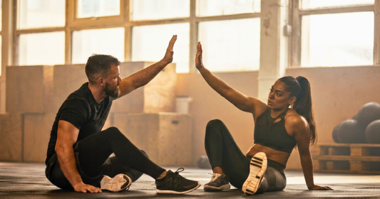 Gym buddies giving a high-five