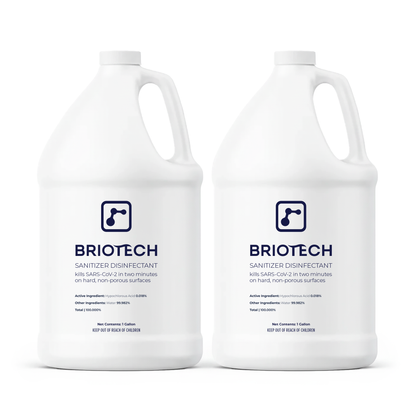 Two white gallon jugs labeled "Sanitizer Disinfectant" with blue text display product info and certification logos. This spray eliminates bacteria and viruses on non-porous surfaces, all set against a white background.