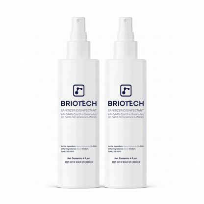Two white 6 fl oz spray bottles of Sanitizer Disinfectant. Eliminates bacteria and viruses, kills SARS-CoV-2 in 2 minutes, for use on hard, non-porous surfaces.
