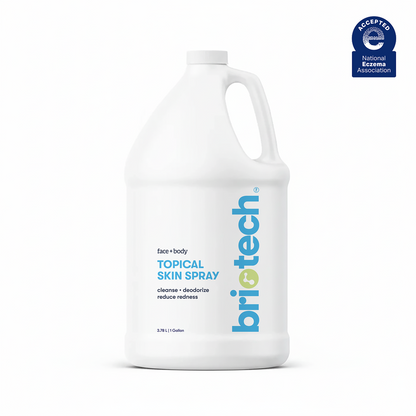 A large white 1-gallon (3.78 L) bottle labeled "Topical Skin Spray" features a handle and contains soothing spray for face and body that cleanses, deodorizes, reduces redness, calms irritation, and promotes healthy-looking skin.