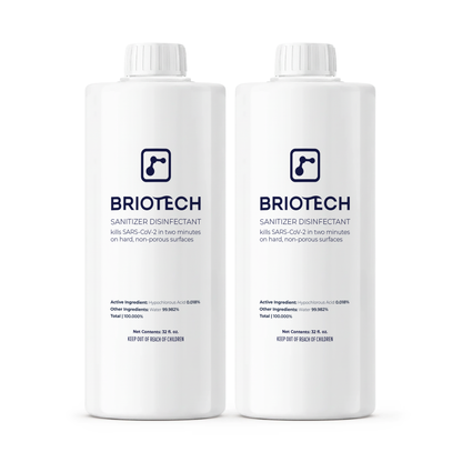 Two white bottles of Sanitizer Disinfectant with blue and gray labels, each 32 fl oz. Designed for non-porous surfaces, they display safety info and certifications, effectively eliminating bacteria and viruses.
