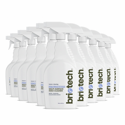 A cluster of white trigger spray bottles of Extra Strength HOCl multi-surface cleaner arranged in rows.