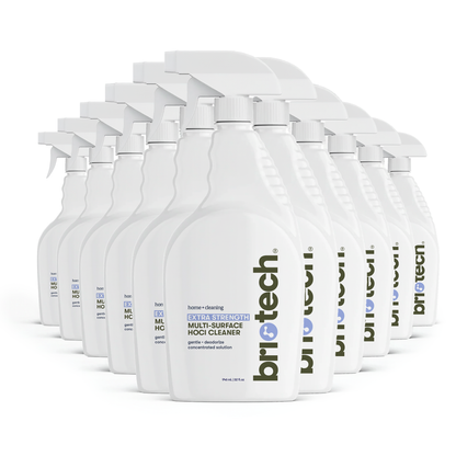 A row of white spray bottles labeled Extra Strength HOCl, designed for powerful cleaning and deodorizing of hard non-porous surfaces, is arranged in a staggered line against a white background.