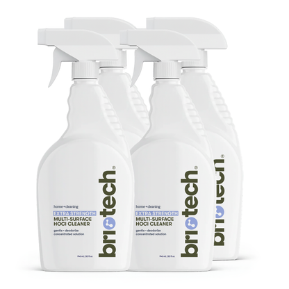 Four white spray bottles of Extra Strength HOCl are grouped together, labels with blue and gray text facing forward. Perfect for advanced cleaning and deodorizing hard, non-porous surfaces.