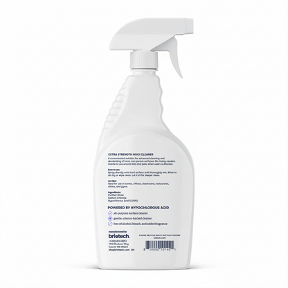 A white spray bottle of Extra Strength HOCl sits against a plain background. It features a trigger spray nozzle and a back label with instructions, ingredients, and warnings. Designed for advanced cleaning of hard, non-porous surfaces.