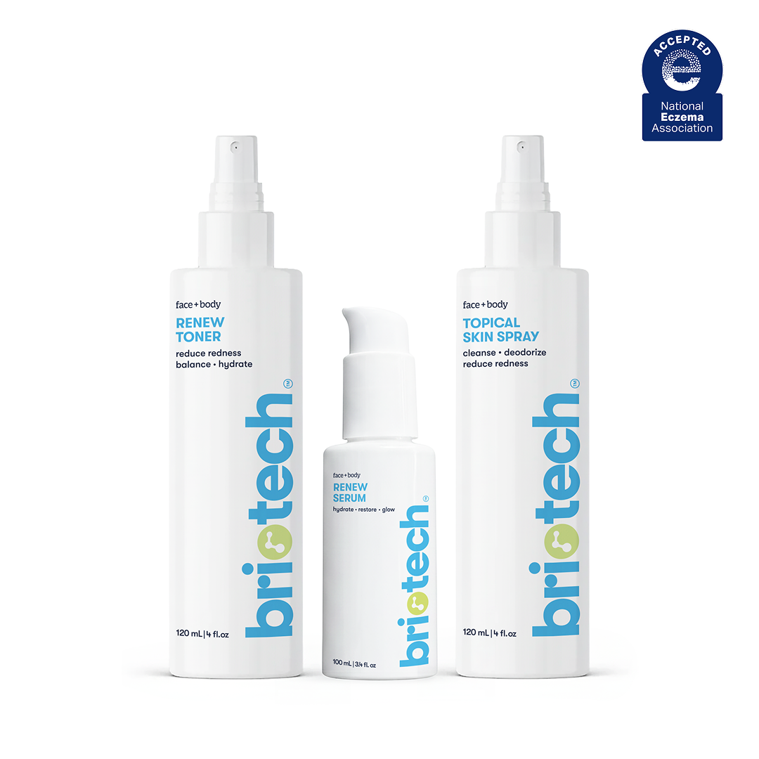 Three white bottles from the Skincare Essentials Set—Renew Toner, Renew Serum, and Soothing Skin Spray—stand upright with the National Eczema Association seal shown in the top right corner.