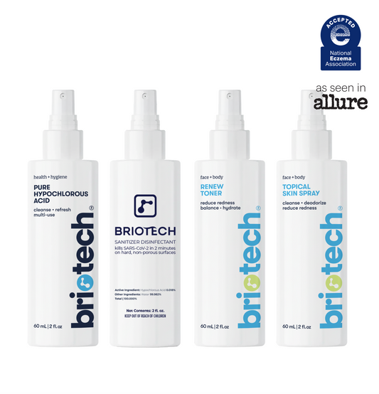 Four white spray bottles from the Travel Essentials Kit labeled Pure Hypochlorous Acid, Sanitizer Disinfectant, Renew Toner, and Topical Skin Spray, with a National Eczema Association seal in the top right.
