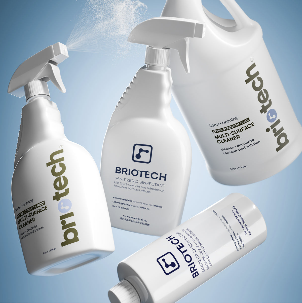 Three white plastic bottles of Extra Strength HOCl Multi-Surface Cleaner arranged against a blue background, with one bottle actively spraying a mist.