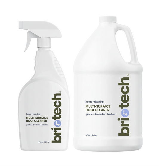 A white 32-ounce trigger spray bottle and a white 1-gallon refill jug, both from the Multi-Surface Cleaner + Refill Bundle and labeled as Multi-Surface HOCl Cleaner.