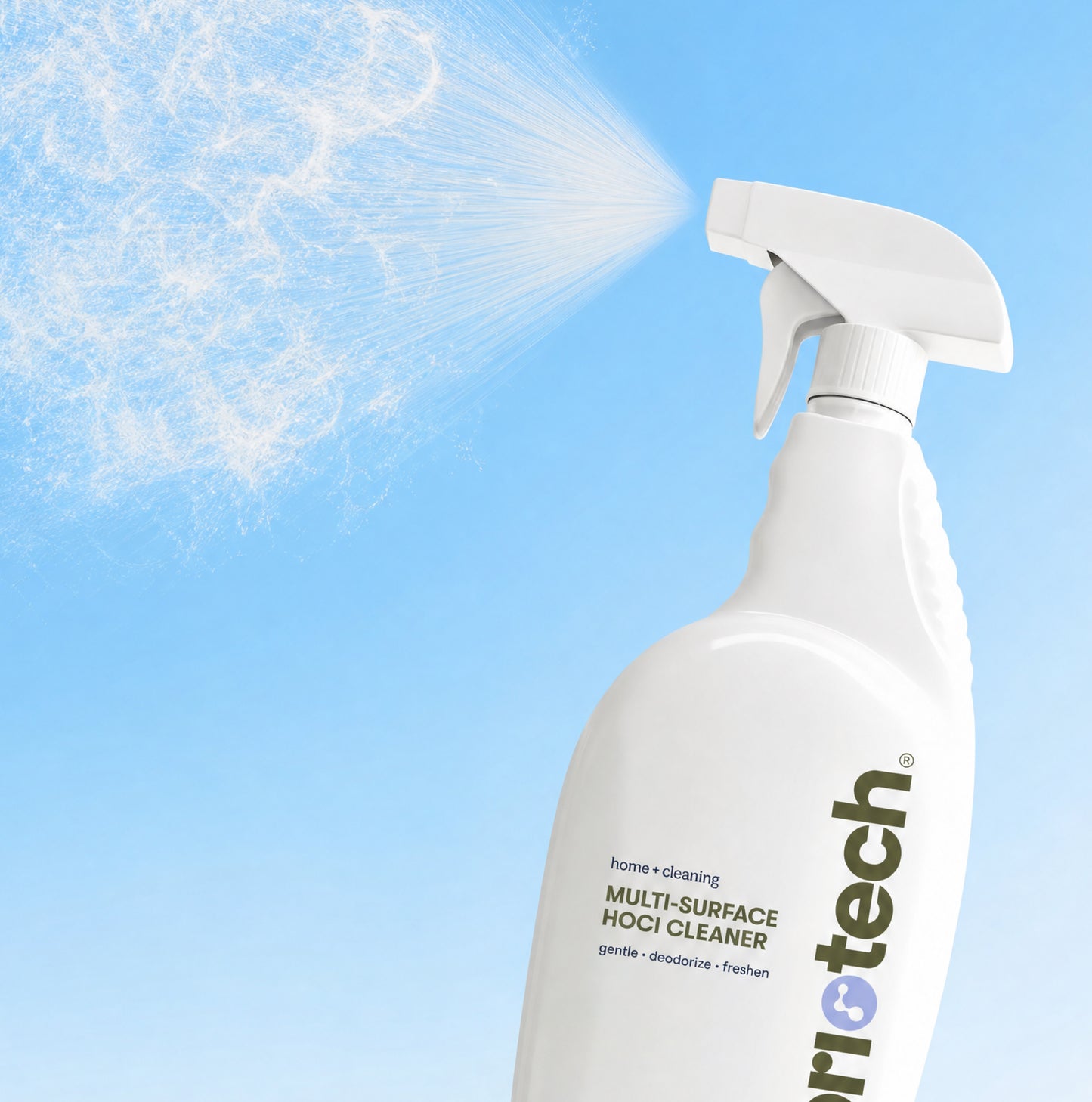 A white spray bottle of Multi-Surface HOCl Cleaner releases a fine mist of its powerful cleaning solution against a blue background.
