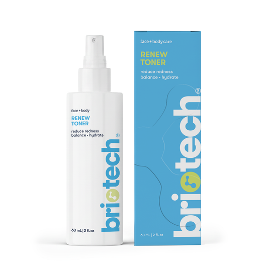 A white spray bottle labeled Renew Toner stands beside its matching blue and white box, both displaying "reduce redness, balance, hydrate"—a facial mist for calm and healthy-looking skin with simple, modern branding.