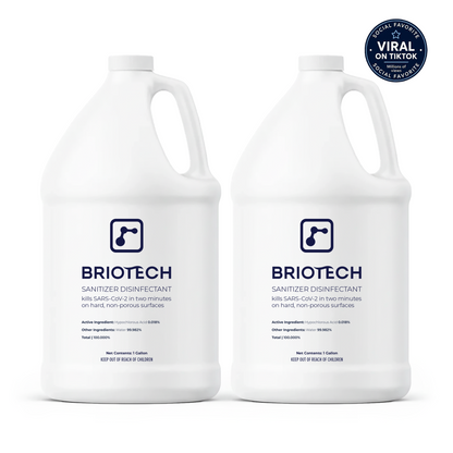 Two gallon-sized white jugs of Sanitizer Disinfectant, each with a handle and a blue label, are placed side by side against a white background. The disinfectant is formulated to effectively eliminate bacteria and viruses on non-porous surfaces. A “Viral on TikTok” sticker is displayed in the top right corner.
