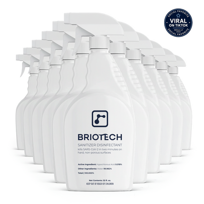 A row of white Sanitizer Disinfectant bottles stands in formation. Labeled for killing SARS-CoV-2, these sprays are designed to target bacteria and viruses on non-porous surfaces, and feature social media badges highlighting their popularity.