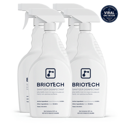 Four white spray bottles of Sanitizer Disinfectant are featured, displaying a “Viral on TikTok” badge in the top right corner. The label emphasizes its effectiveness as a disinfecting spray designed to eliminate bacteria and viruses from hard, non-porous surfaces.