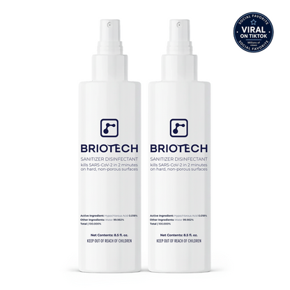 Two white bottles of Sanitizer Disinfectant stand side by side, their labels displaying product details and safety warnings that highlight effectiveness against bacteria and viruses on non-porous surfaces. A blue “Viral on TikTok” badge is featured in the top right corner.