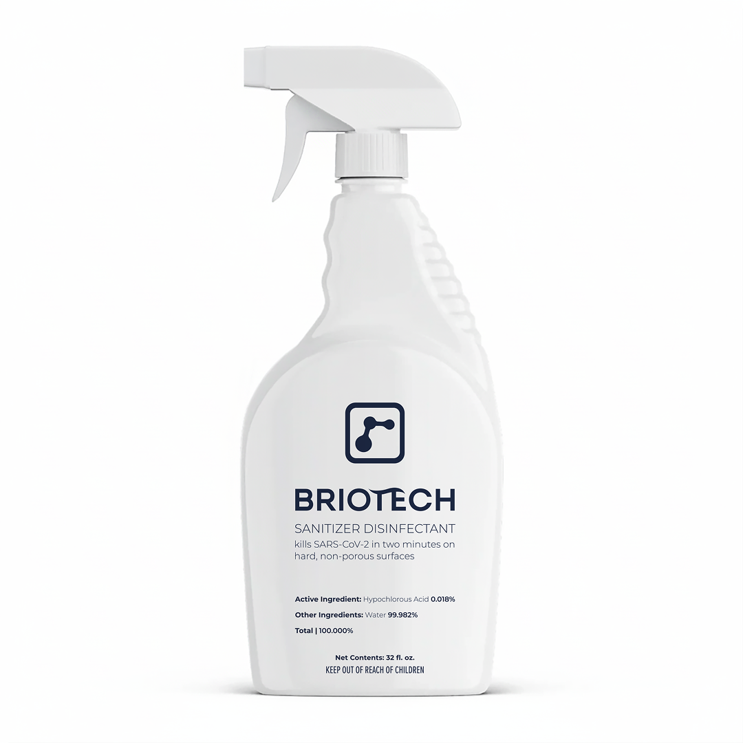 A white spray bottle labeled Sanitizer Disinfectant, a disinfecting spray for non-porous surfaces, displays text about killing SARS-CoV-2 in two minutes set against a plain white background.