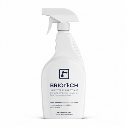 A white spray bottle labeled Sanitizer Disinfectant, a disinfecting spray for non-porous surfaces, displays text about killing SARS-CoV-2 in two minutes set against a plain white background.